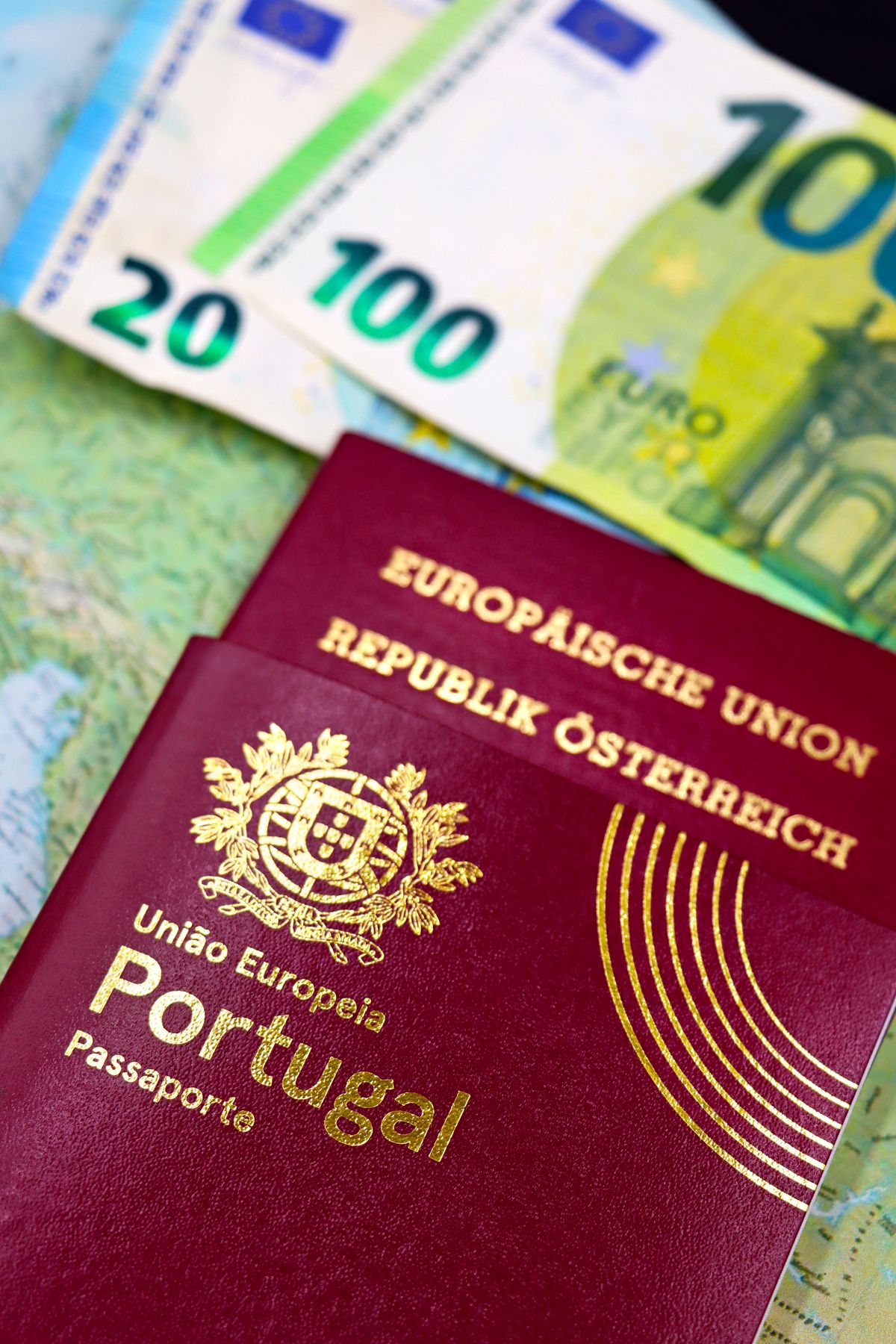 A passport and travel documents laid out on a desk