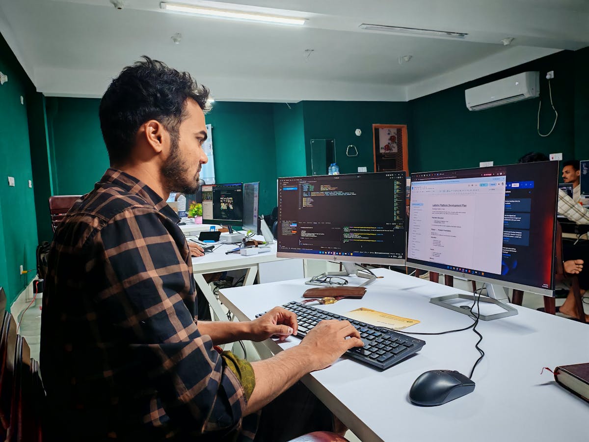 A developer reviewing code repositories on a laptop