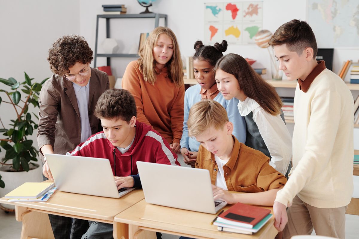 A student preparing for campus placements with a laptop and notes